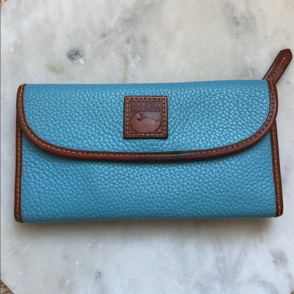 Dooney & Bourke Pebble Grain Continental Clutch Wallet Sky Blue Leather Logo